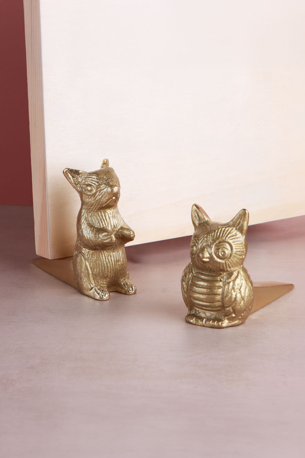 Woodland owl and squirrel door stoppers in polished brass