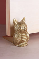 Owl door stopper in polished brass