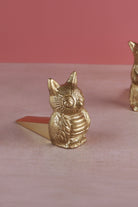 Owl door stopper in polished brass, side view