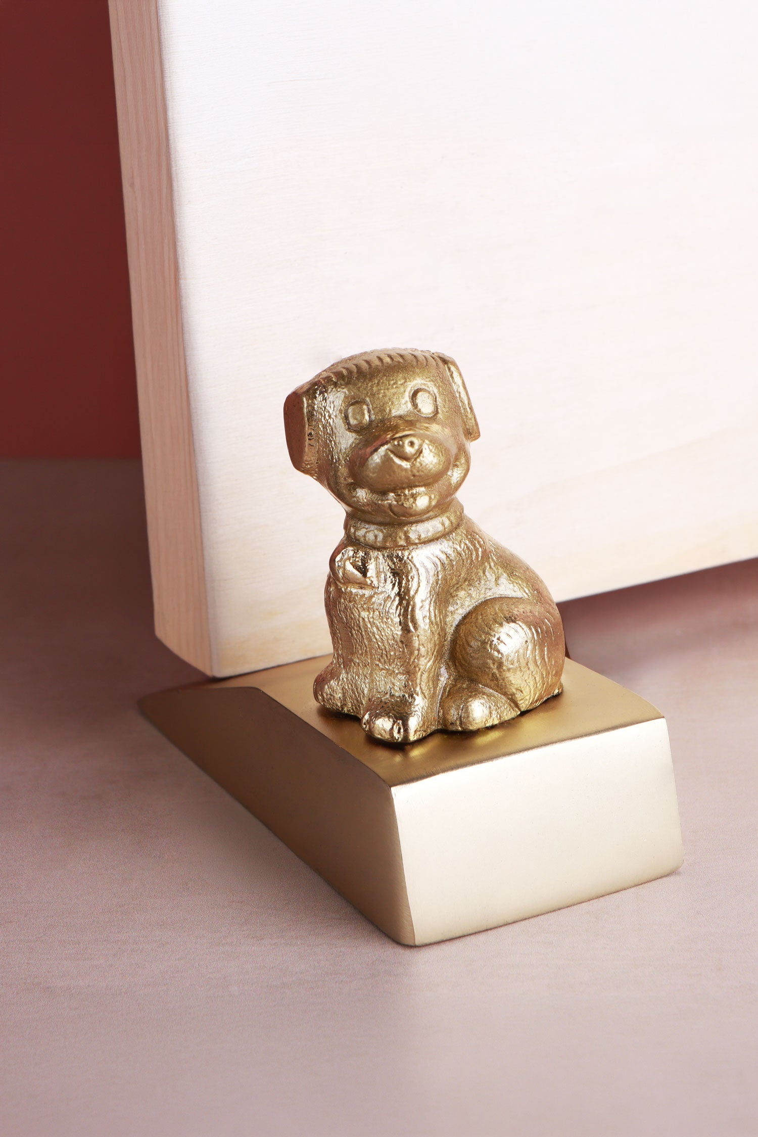 Dog door stopper in polished brass