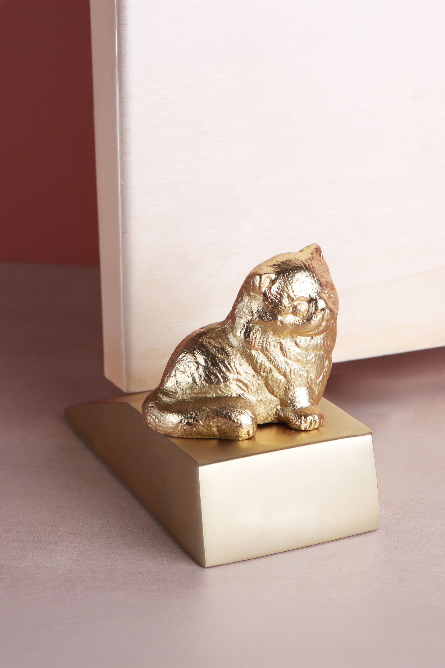 Cat door stopper in polished brass