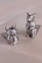 Chrome Woodland door stoppers holding an interior door
