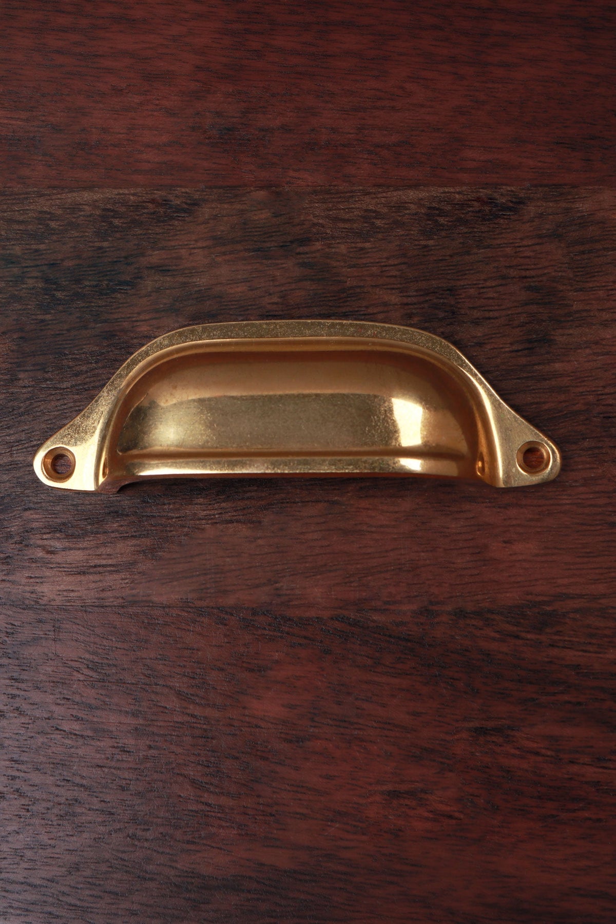 Classic aged brass cup pull, 4 inch, with exposed fixing lugs and no backplate