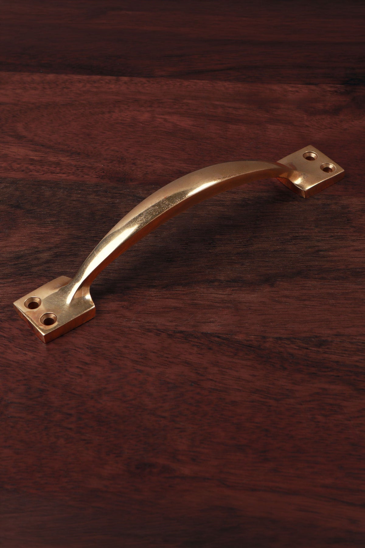 Aged brass cupboard pull handle, 6 and a quarter inch, bowed with square backplates