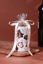 Bouquet Royale Autumn Garden Pillar Candle in Beige with Aged Brass — close-up view, G Decor
