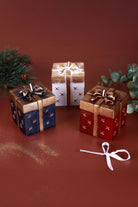Gift Box Celebration Candle in Holiday Red Midnight Blue or Soft White — lifestyle view, G Decor