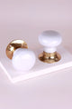White and gold luxury door knobs by G Decor on a white display block