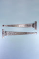 Pair of silver metal T-hinges for doors or cabinets on a light blue background, G Decor hardware