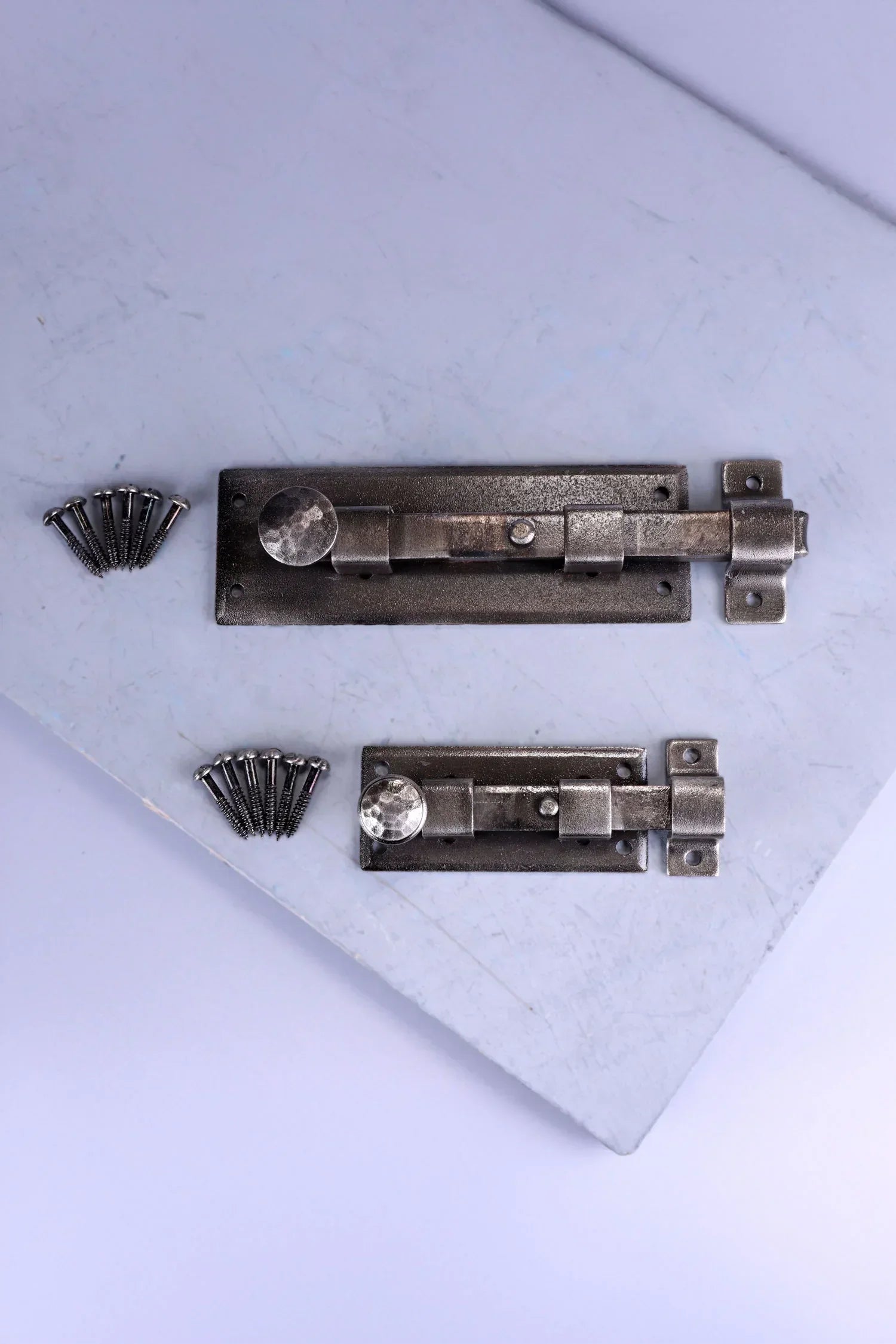 Hand-Forged Hammered Iron Sliding Door Bolt, Pewter — close-up view, G Decor