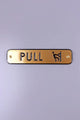 Brass metal pull door sign with embossed letters and icon, G Decor hardware.