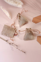 Set of 2 or 4 Rustic Jute Gift Bag Favour Pouches with Kraft Tags — lifestyle view, G Decor