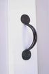 Matte black metal door handle on white surface, luxury hardware by G Decor