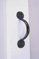 Matte black metal door handle on white surface, luxury hardware by G Decor
