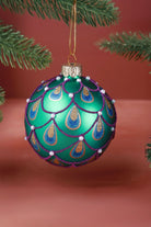 Hand-Painted Peacock Tail Glass Christmas Bauble in Emerald or Royal Blue — lifestyle view, G Decor