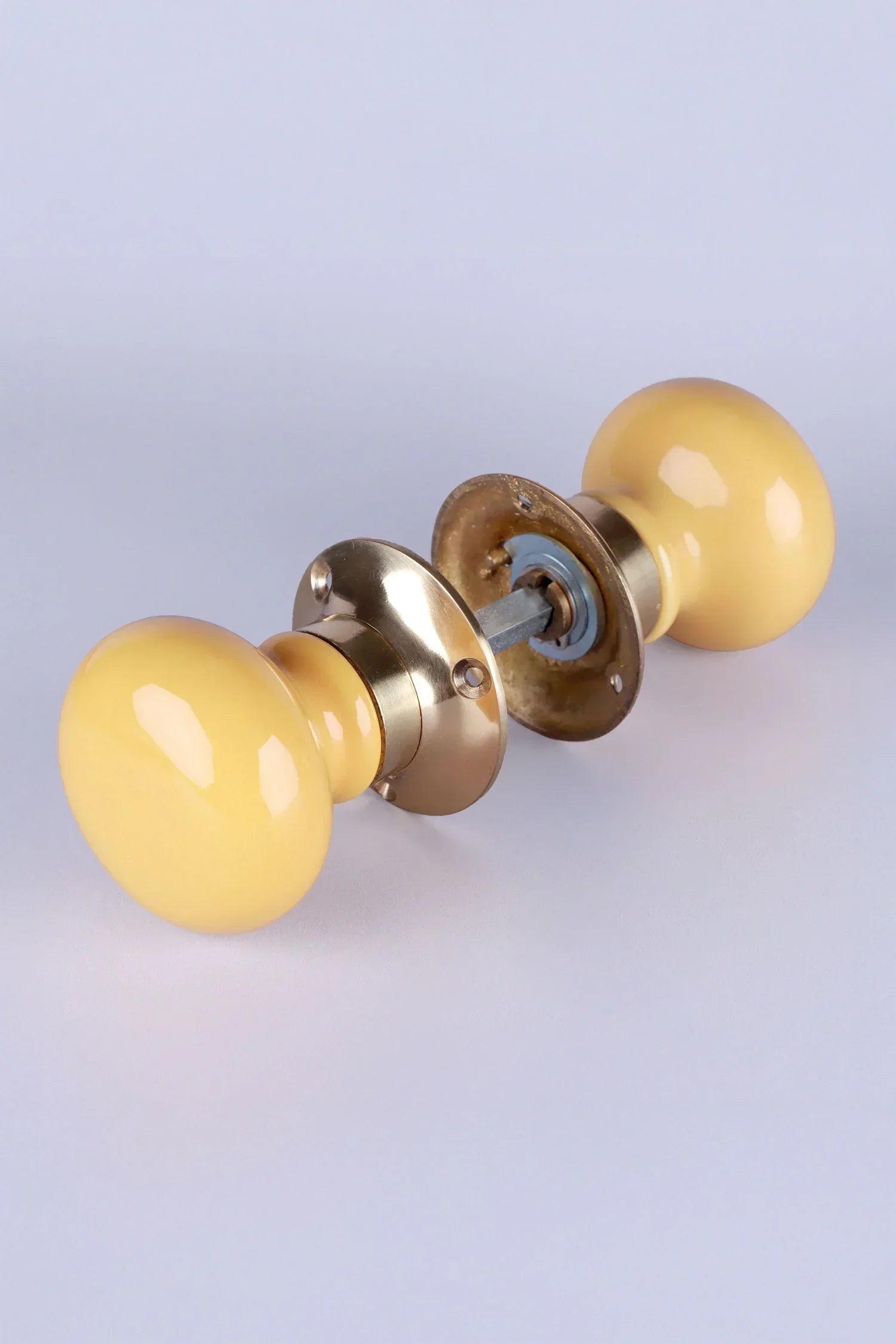 Brassworks Edit Sand Yellow Ceramic Mortice Door Knobs with Brass Base — close-up view, G Decor