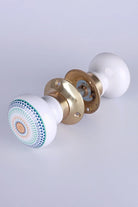 Positive Energy Aura Porcelain Mortice Door Knobs with Brass Base — close-up view, G Decor
