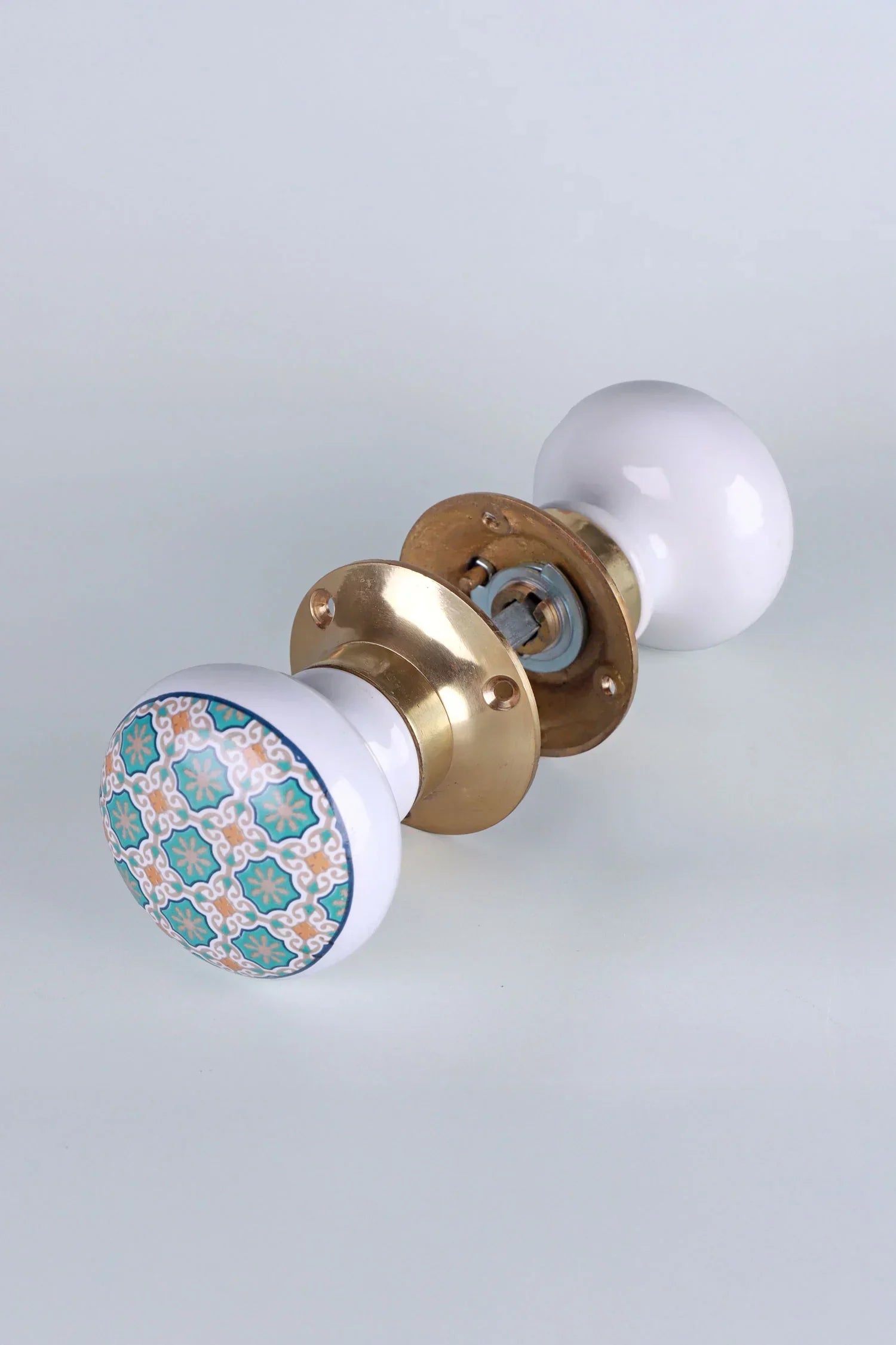 Divine Will Brass Edition Porcelain Mortice Door Knobs with Brass Base — close-up view, G Decor