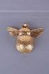 Gold bumblebee drawer pull by G Decor on gray background, luxury hardware home décor