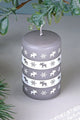 Grey pillar candle with white moose and snowflake patterns, G Decor luxury home décor.