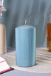 Luxury blue ribbed pillar candle on a woven mat, home décor by G Decor