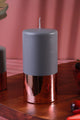 Luxury pillar candle with metallic copper base on wooden surface, G Decor home décor