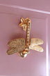 Gold dragonfly luxury cabinet handle on pink door, G Decor home hardware detail