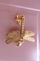 Gold dragonfly luxury cabinet handle on pink door, G Decor home hardware detail