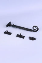 Hand-Forged Monkey Tail Window Stay, Beeswax — lifestyle view, G Decor