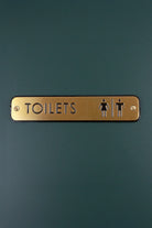 Satin Brass Engraved Door Sign for Restroom Toilets or Private — close-up view, G Decor