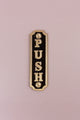 Gold and black metal push door plate by G Decor on a light pink background