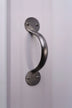 Brushed metal pull handle on white panel door, luxury hardware by G Decor.
