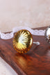 Runde Glastürknöpfe mit Rädern in Gold und Grau