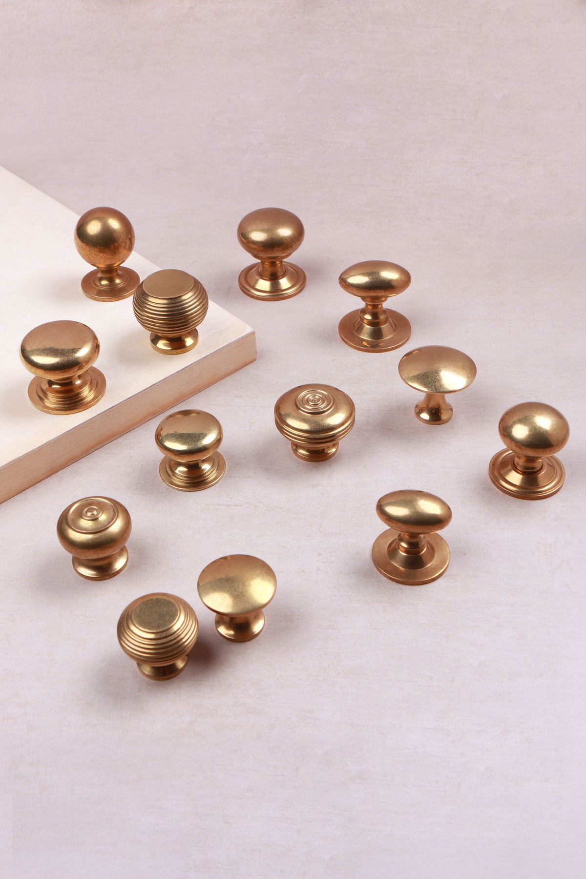 Aged brass cabinet knobs in thirteen styles, third view