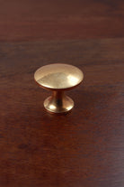 Flat-topped aged brass cabinet knob, second view
