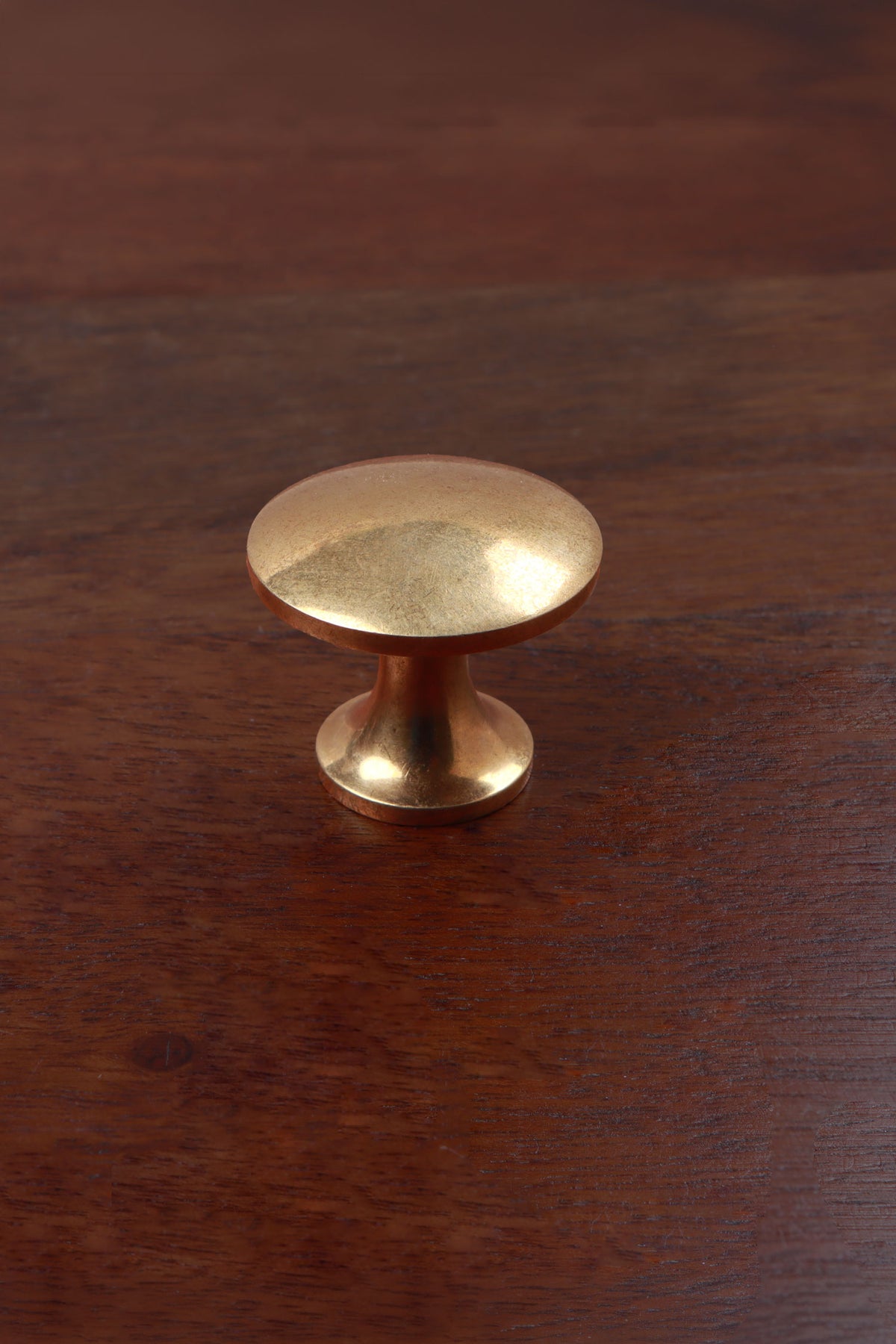 Flat-topped aged brass cabinet knob, second view