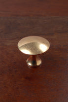 Flat-topped aged brass cabinet knob