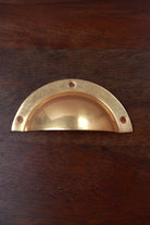 Half moon aged brass cup pull, 4 inch