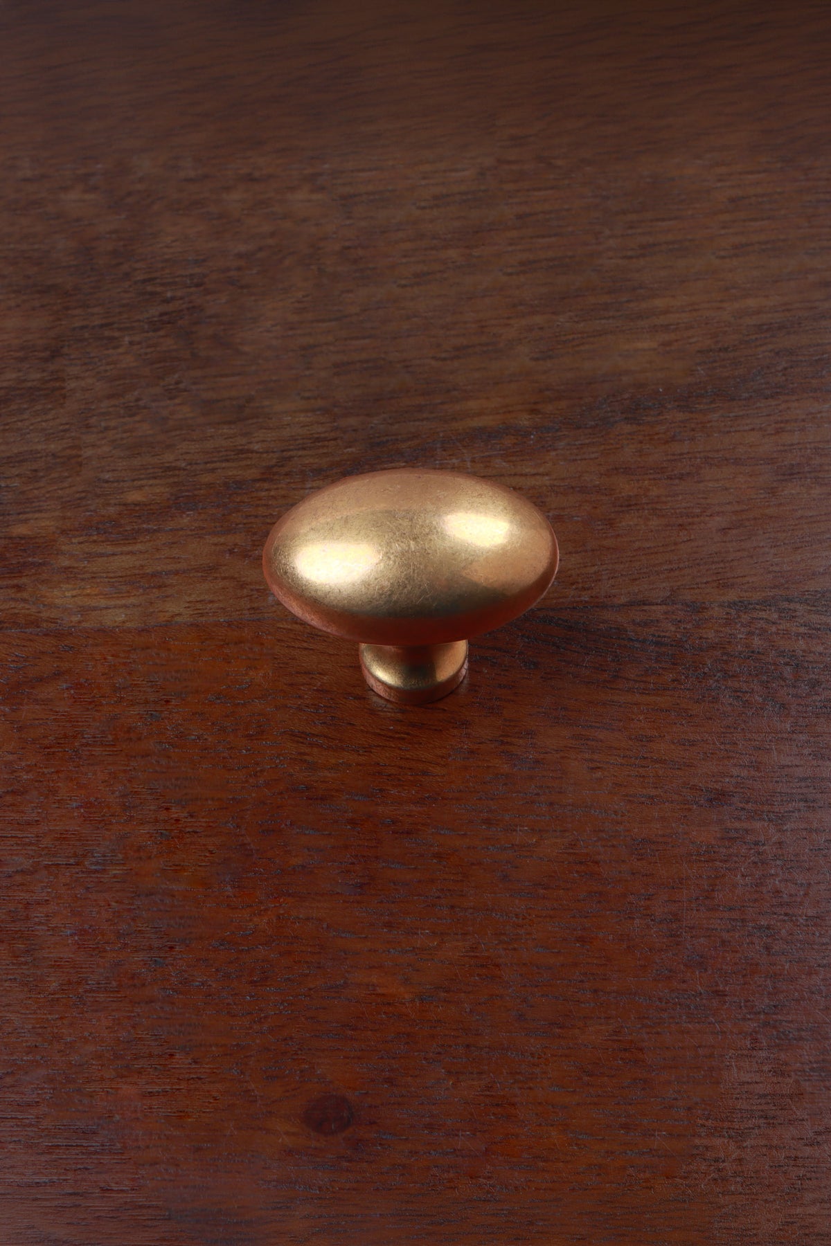 Aged brass oval cabinet knob, second view