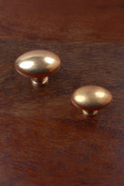 Aged brass oval cabinet knobs, 38mm and 32mm