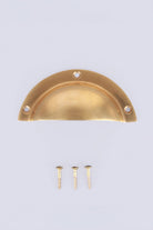Stepped rim aged brass cup pull with its screws