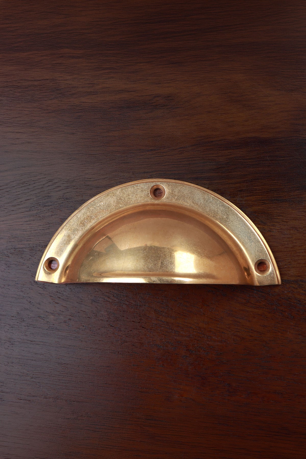 Stepped rim aged brass cup pull, 4 inch