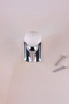 Antique ivory crackle glaze ceramic ball hook on a chrome finish hook, with its two screws