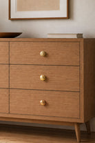 Beehive brass cabinet knobs on oak drawer fronts