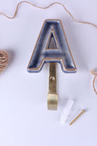 Blue ceramic letter hook A with a gold rim