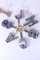 Blue ceramic letter hooks, fourth view