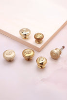 Bloxwich brass cabinet knobs showing the ringed bullseye face