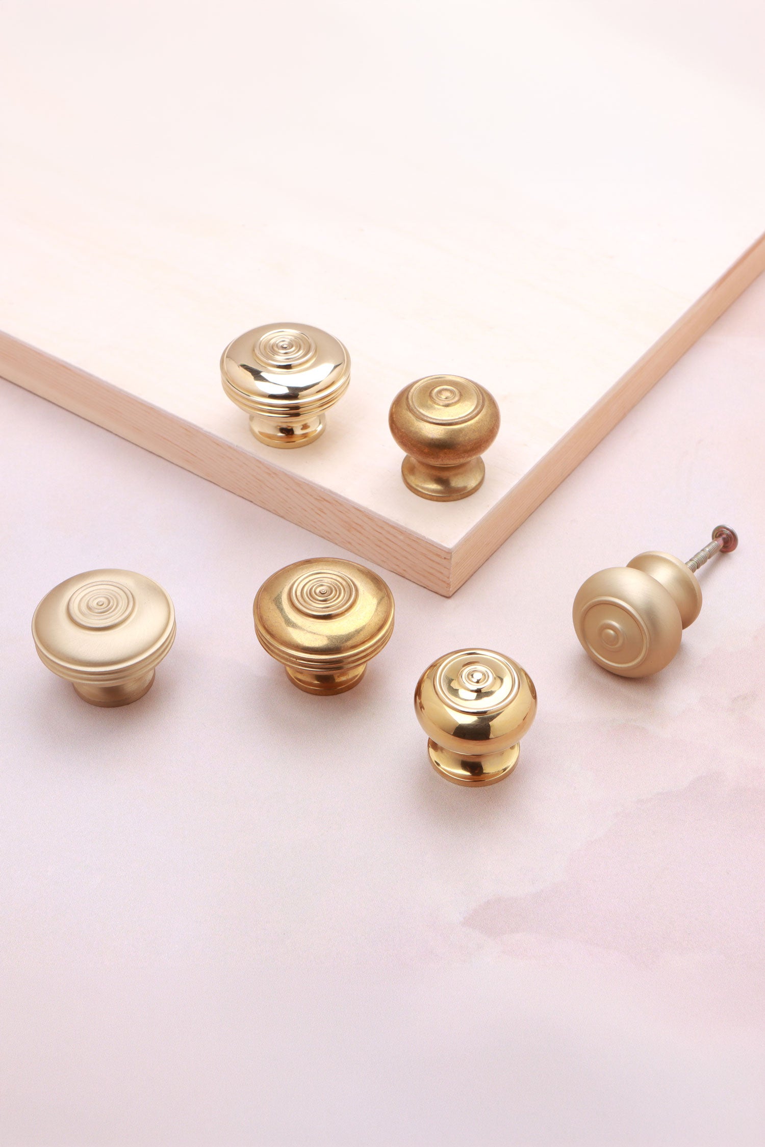 Bloxwich brass cabinet knobs showing the ringed bullseye face