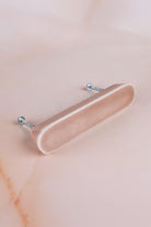 Brown ceramic bar handle, a warm light brown glaze with a fine crackle, with its two fixing bolts