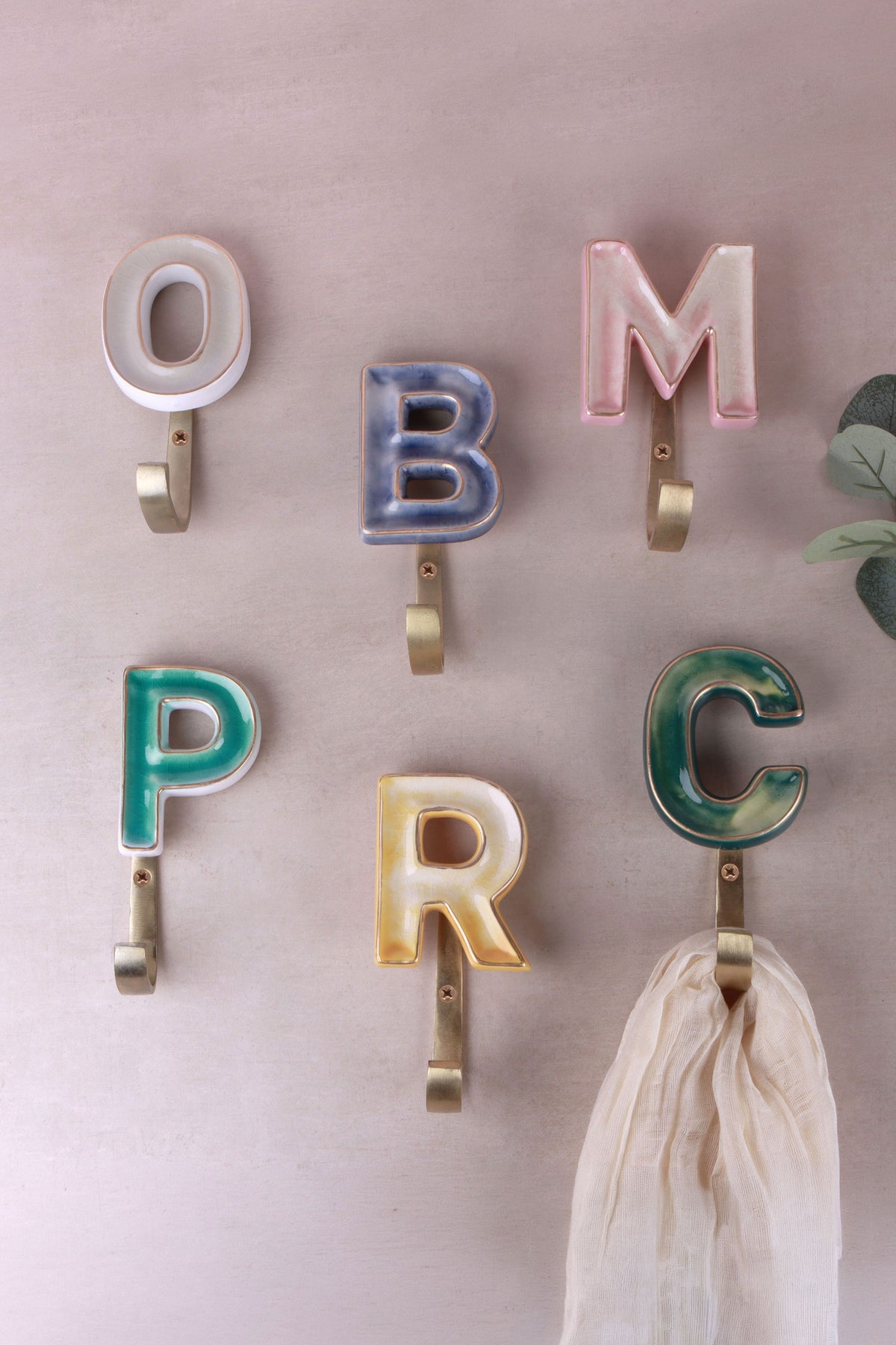 Mixed-colour ceramic letter hooks with gold rims, second view