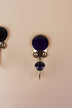 Dark blue ceramic coat hook: deep navy blue disc in a gold-tone frame with a matching dark blue ceramic knob